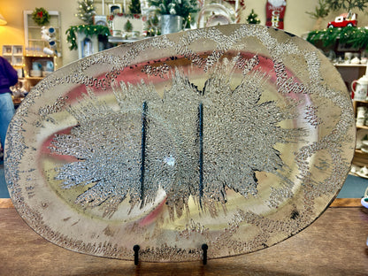Silver round divided platter with textured atomic splash pattern and two compartments