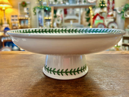 Ceramic footed bowl with green leaf rim band and floral motif