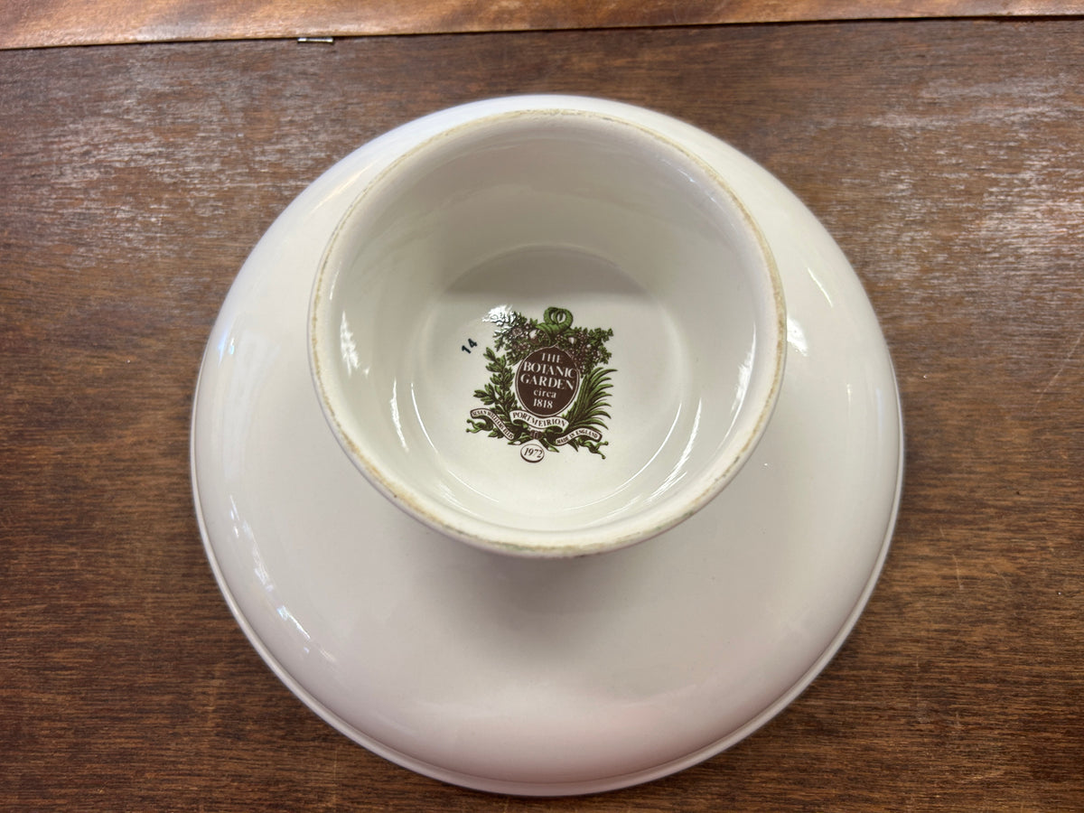 Bottom of ceramic footed bowl with printed emblem on white base