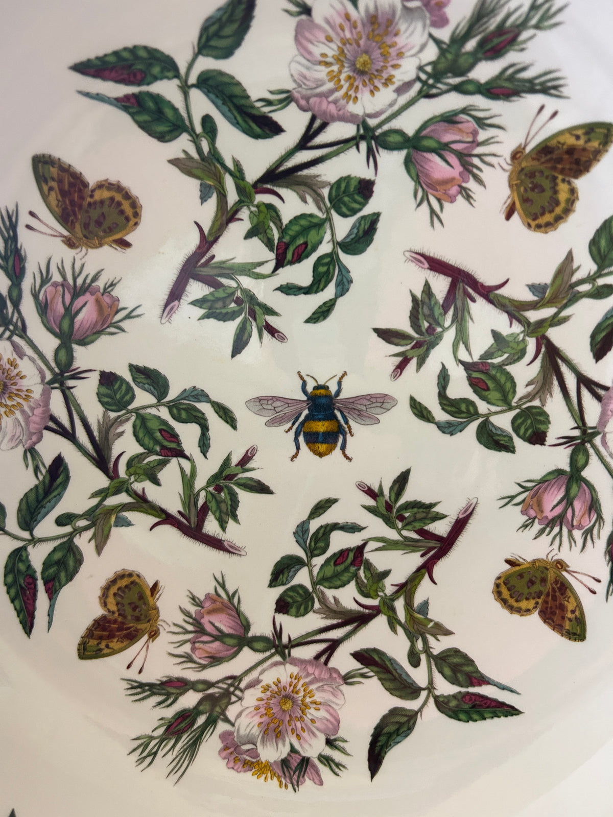 Botanic Garden serving bowl pattern view with pink flowers, green leaves, butterflies