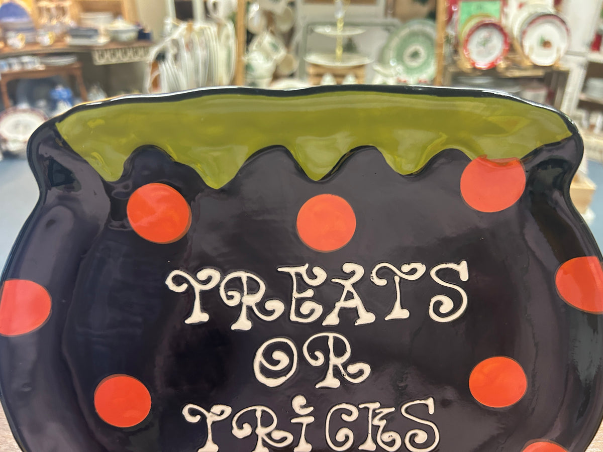 Dark Halloween cauldron platter with orange polka dots and 'Treats or Tricks' wording