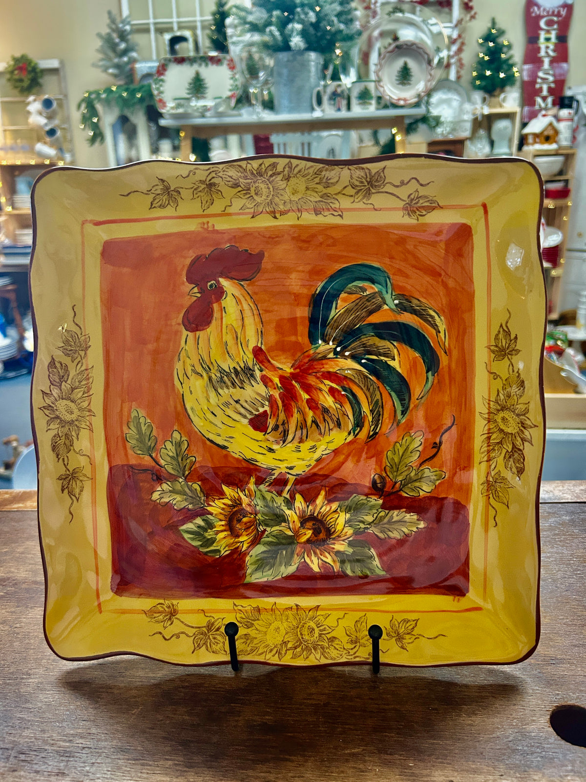Orange and yellow rooster square platter with floral border and rooster center artwork.