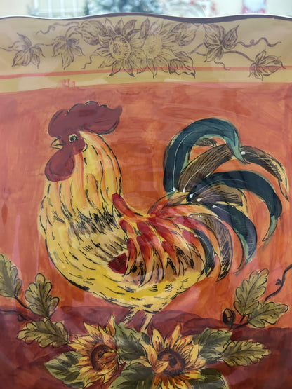 Orange and yellow rooster square platter featuring detailed rooster with floral accents.