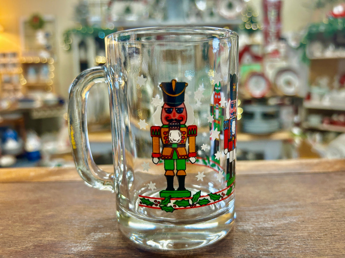 Christmas nutcracker glass mug with colorful nutcracker figure and star details