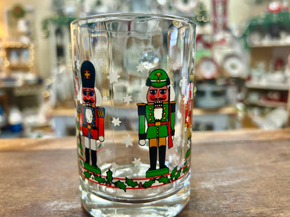Holiday nutcracker glass mug showing two nutcracker character prints on front