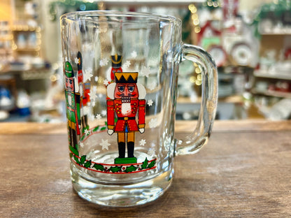 Libbey nutcracker glass mug with central nutcracker illustration and white stars