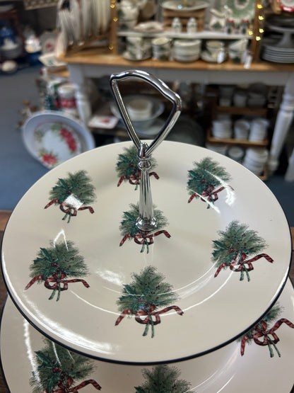Two-tier holiday serving stand with patterned plates and chrome center support