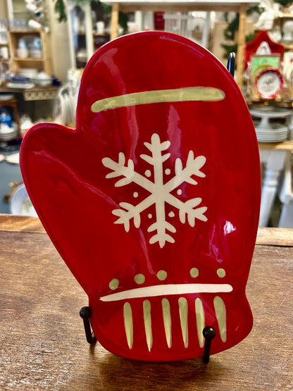 Red ceramic mitten-shaped decorative plate with white snowflake and striped design