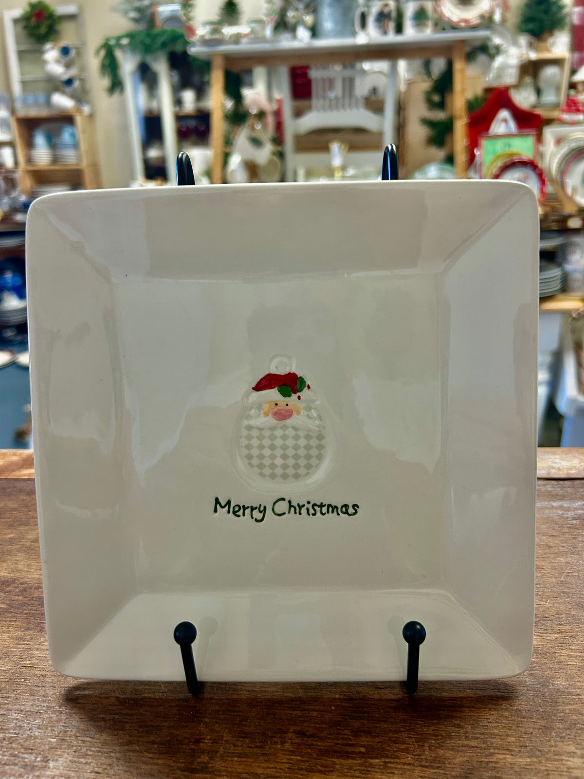 White square Christmas cut-out plate with Merry Christmas text and Santa figure