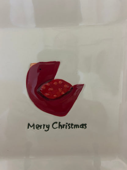 White square plate with red cut-out bird and “Merry Christmas” message