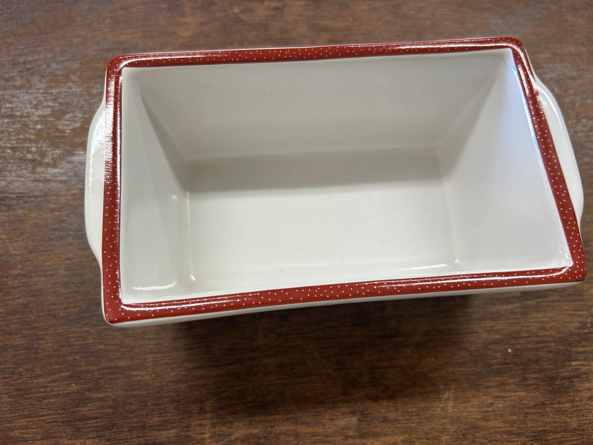 White interior mini loaf pan with red speckled trim