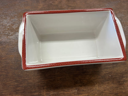 White interior mini loaf pan with red speckled trim