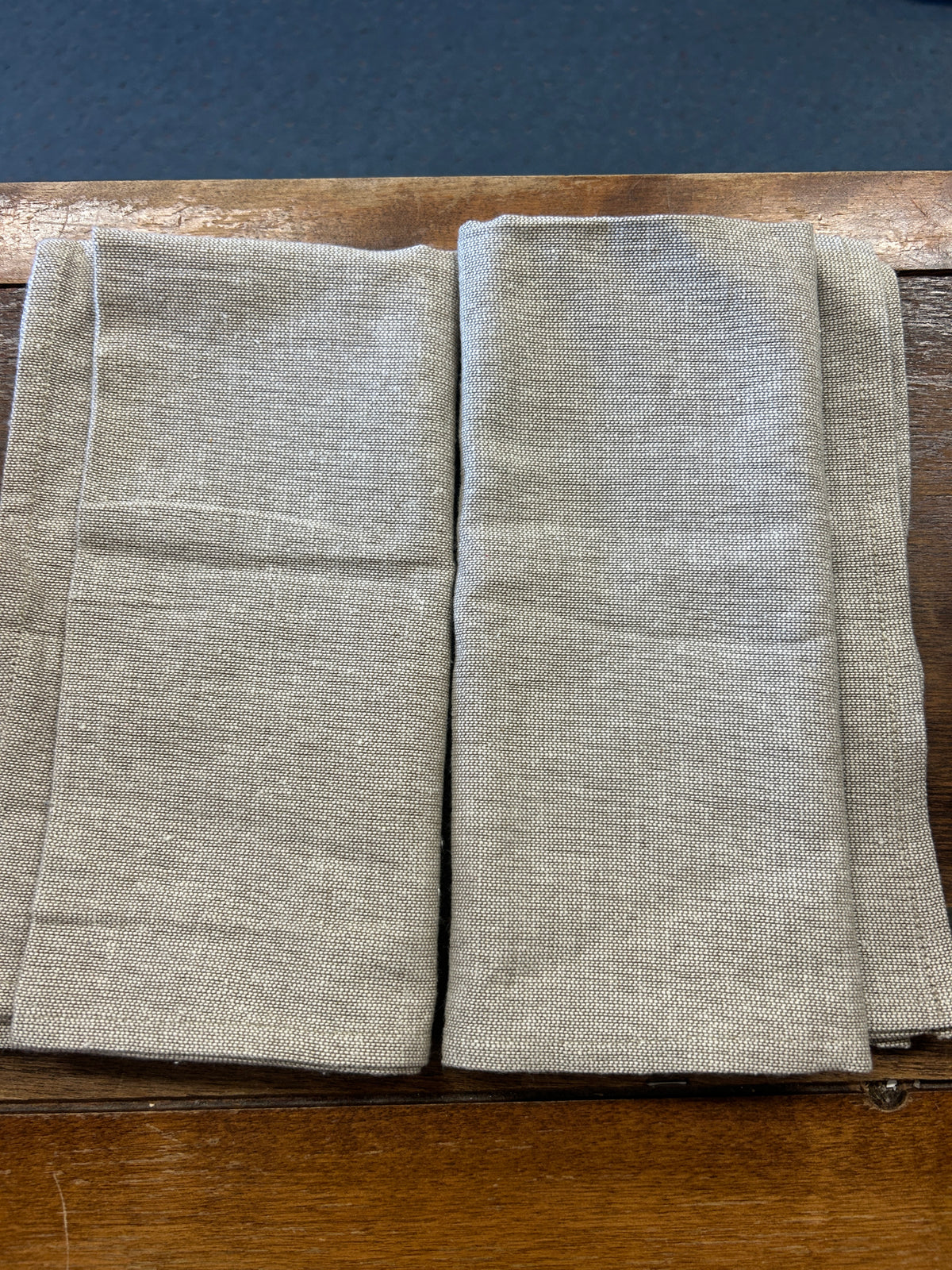 Set of 2 plain linen-style napkins, folded with no visible applique