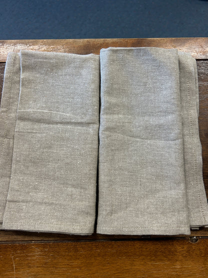 Set of 2 plain linen-style napkins, folded with no visible applique