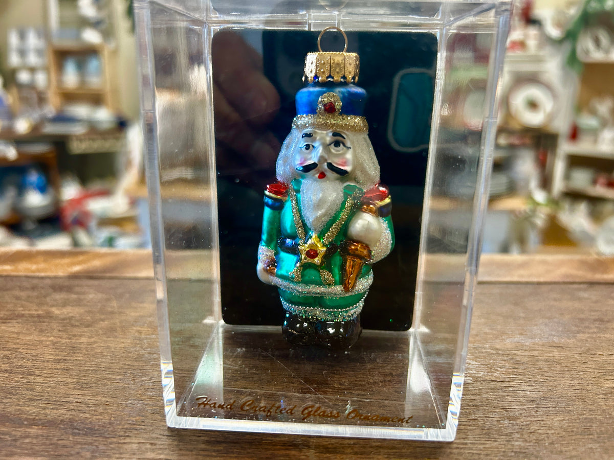 Nutcracker ornament in clear gift box, painted blue and green soldier with hat