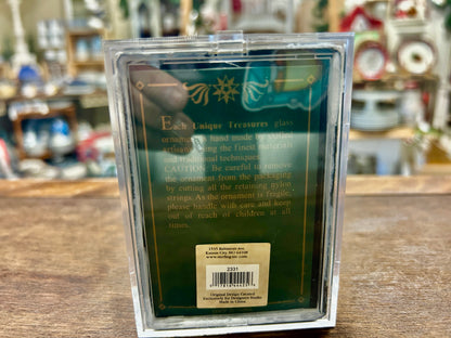 Back of clear ornament box with decorative panel and barcode sticker