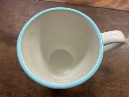 Blue and white Christmas mug interior with rounded rim and side handle