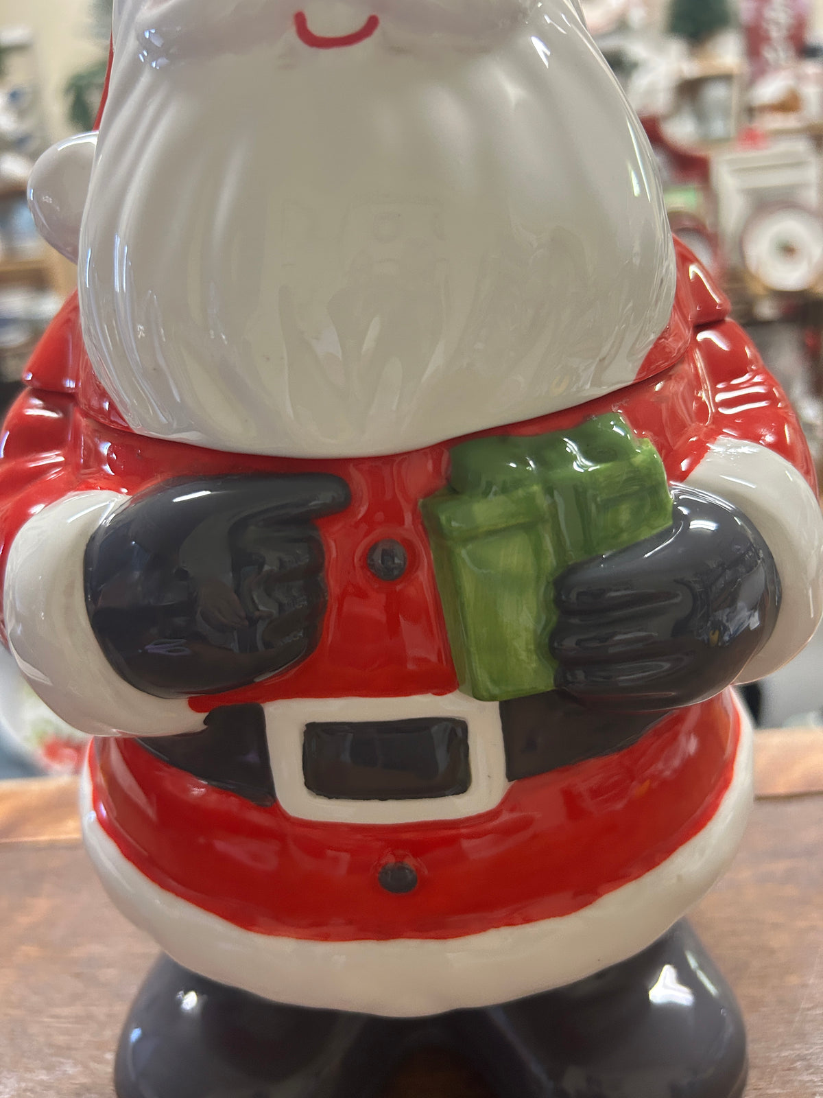 Santa cookie jar torso detail, red suit with green belt and black boots