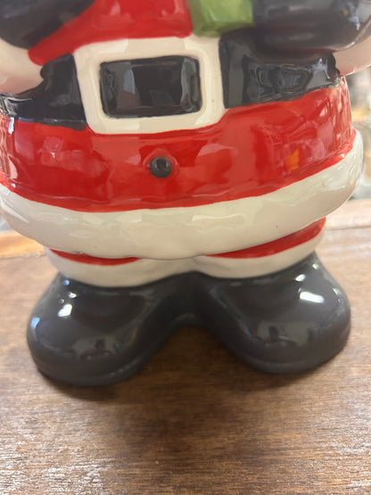 Santa cookie jar bottom detail, black boots and red outfit with white stripes