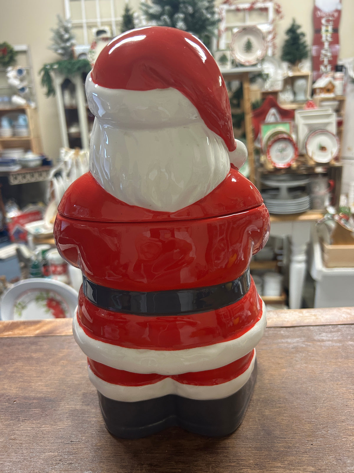 Santa cookie jar side/back view, red and white striped body with dark boots