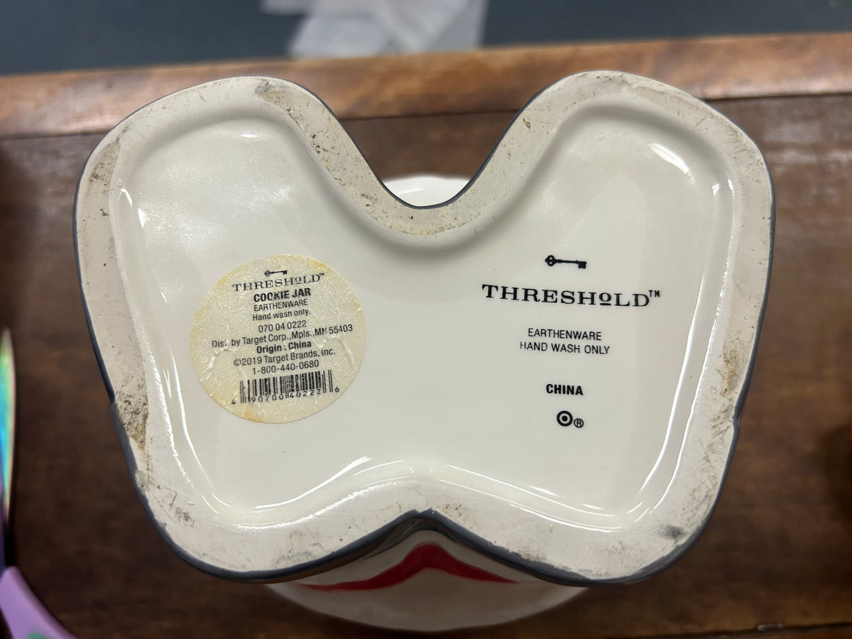 Threshold cookie jar base, white ceramic underside with printed product labels