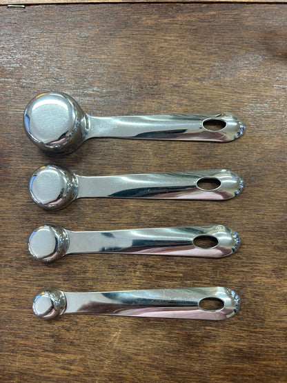Set of 4 stainless steel All-Clad measuring spoons with engraved teaspoon scale