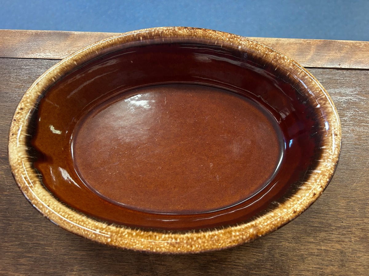 Oval brown drip ceramic baking dish with glazed rim, 10-inch size