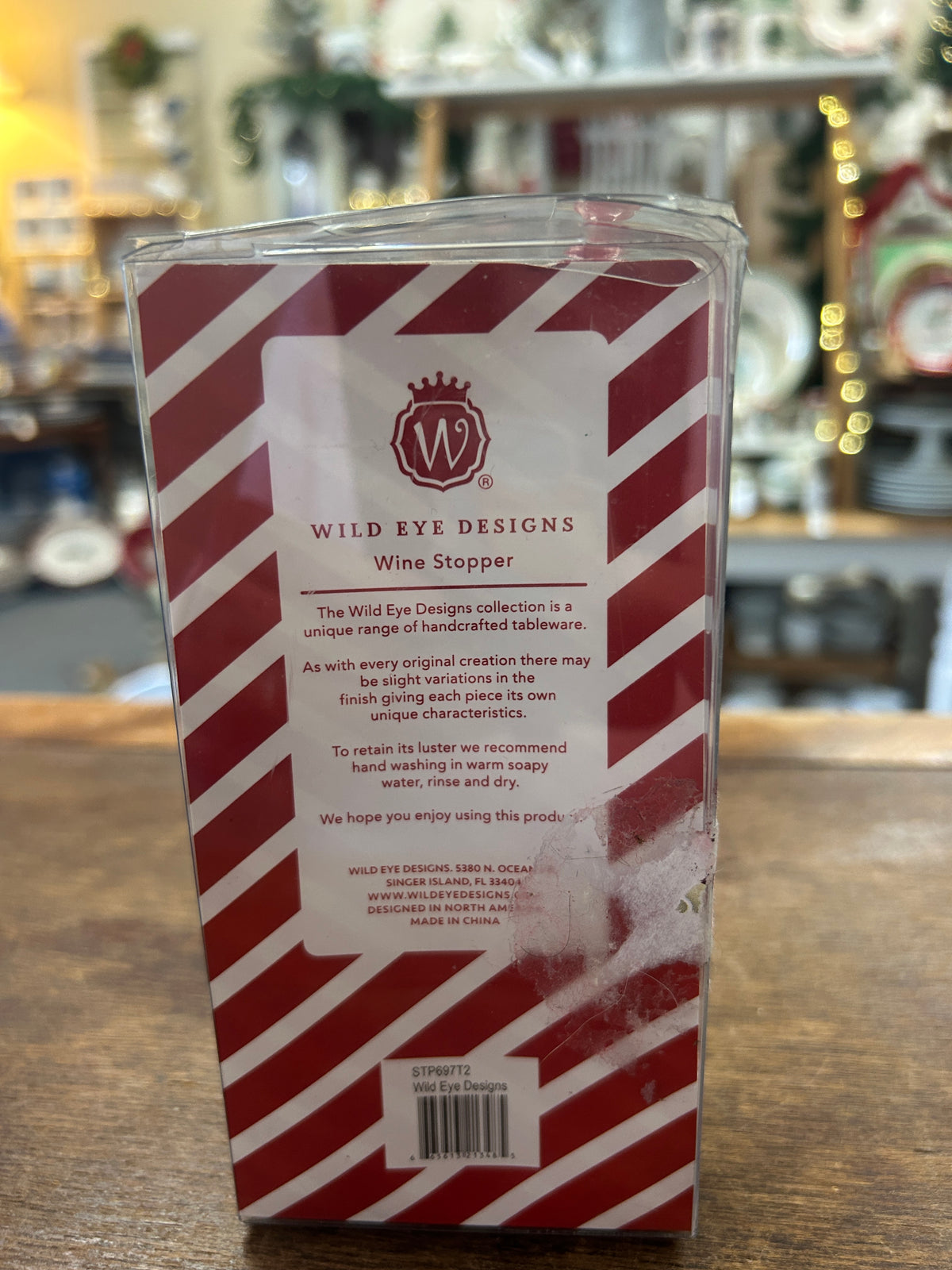 Wild Eye Designs wine stopper box back with red-and-white candy-cane pattern and product info