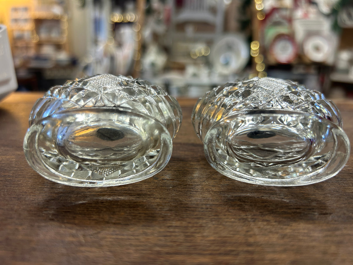 Vintage clear glass salt & pepper shakers, close-up of shaker openings