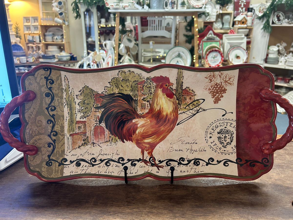 Rooster serving platter with maroon handles and village illustration