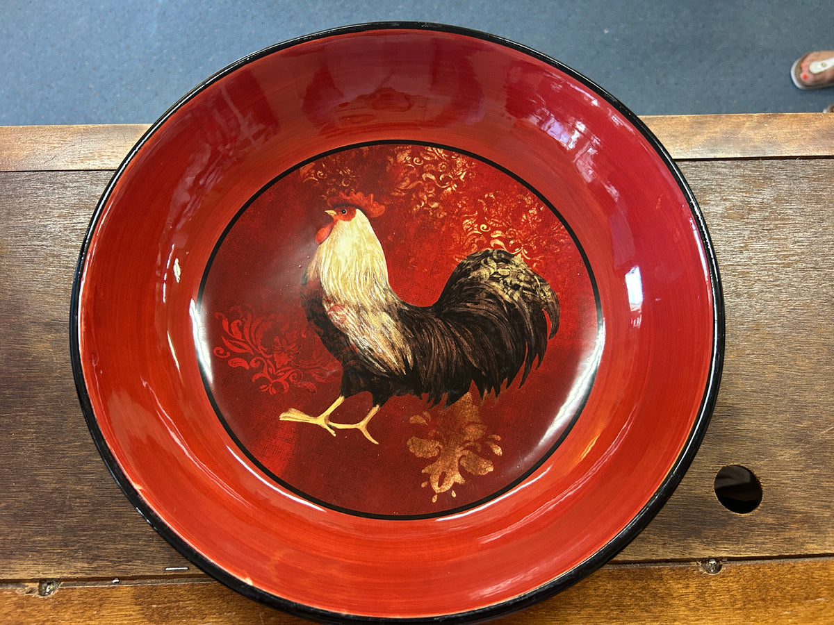 Red rooster bowl interior with glossy rooster artwork in center