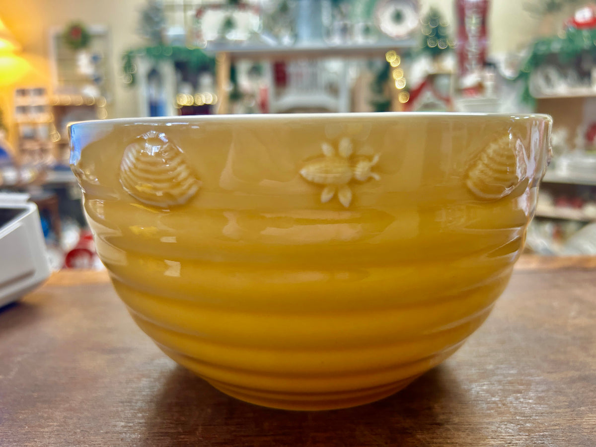 Yellow ceramic bowl with embossed bees and flowers, wide rim