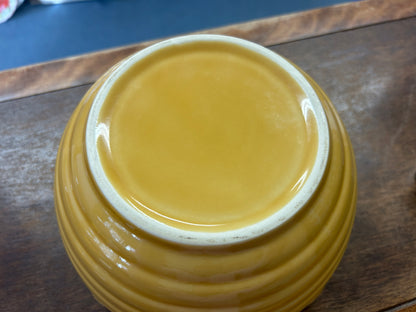 Yellow ceramic bowl top view, glossy glaze and rounded rim