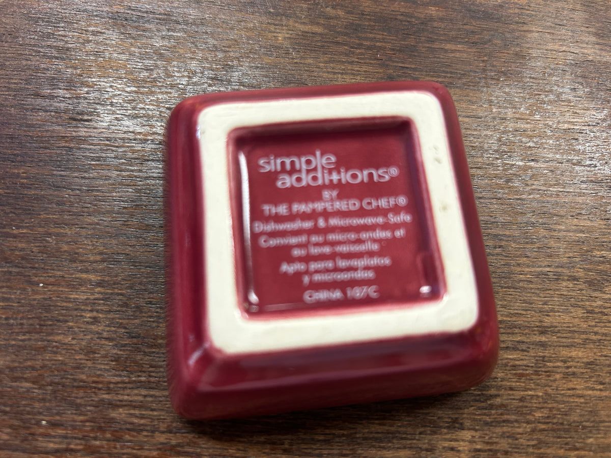 Square red bowl base with Simple Additions and Pampered Chef logo text