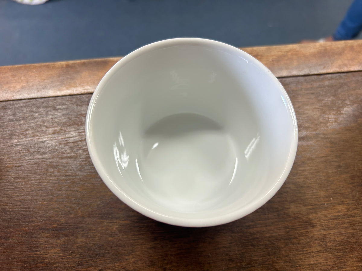 Pink and white ceramic bowl interior, smooth glaze with no decoration visible