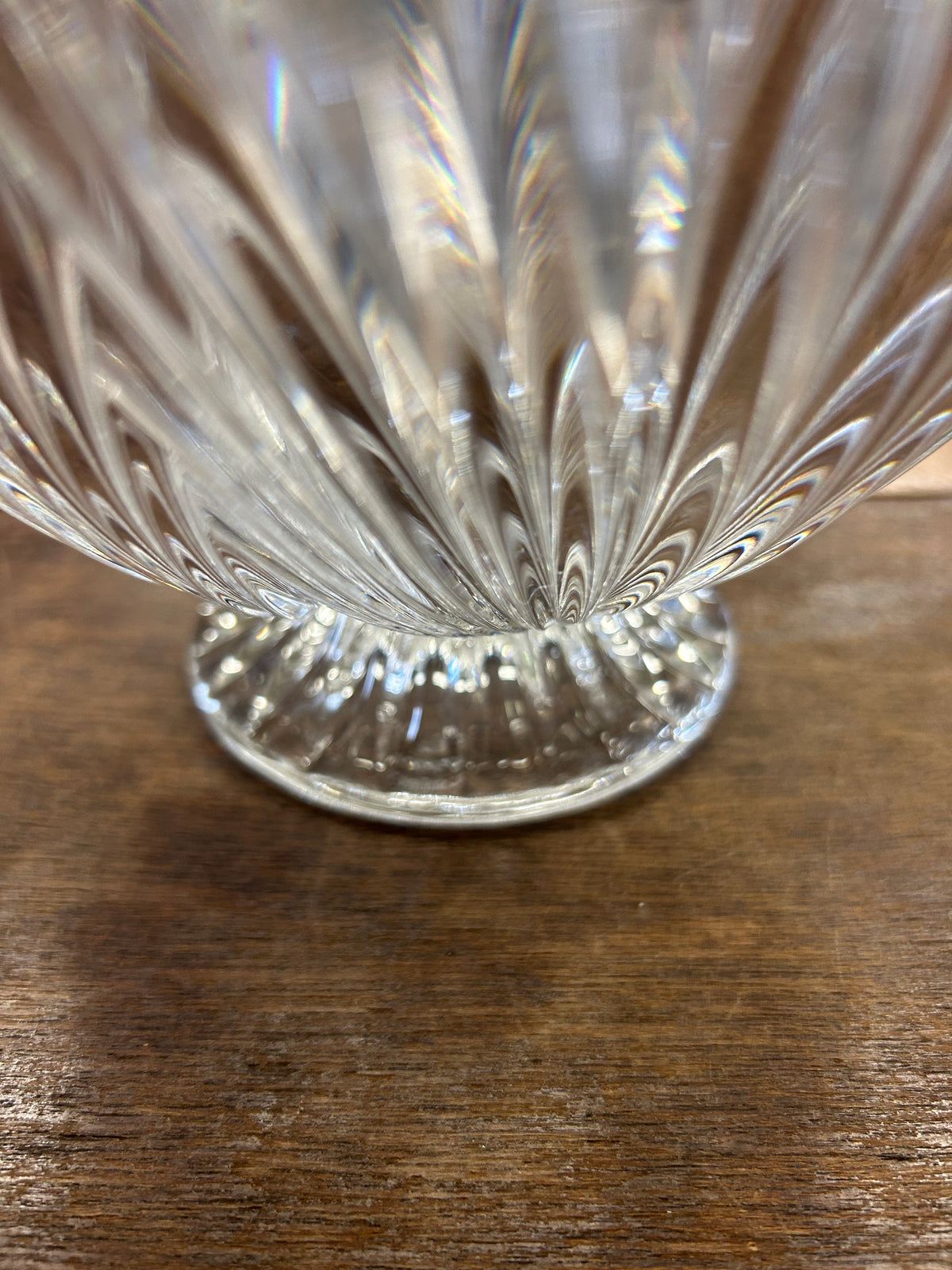 Clear crystal shell bowl close-up, faceted fluted pattern and scalloped rim